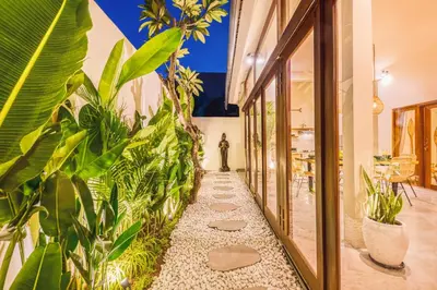 a corridor with plants in a building at 3BR Villa | Seminyak Central | 450m From Beach in Seminyak