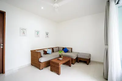 a living room with a couch and a table at Harmony Beach Suite in Seminyak