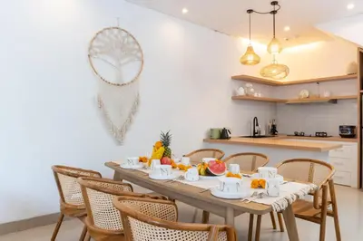 a dining room with a table with fruit on it at Canggu 3BR Private Pool Villa 3 min to Beach Finns in Canggu