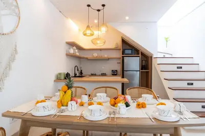 a dining room table with fruits and vegetables on it at Canggu 3BR Private Pool Villa 3 min to Beach Finns in Canggu