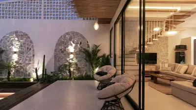 a living room with a couch and a table at Casa Amani 3BR Mediterranean w Pool Near Seminyak in Kerobokan