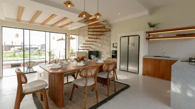 a kitchen and dining room with a table and chairs at Casa Amani 3BR Mediterranean w Pool Near Seminyak in Kerobokan