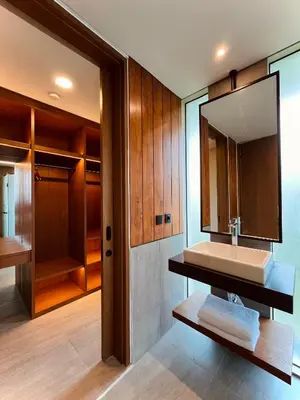 a bathroom with a sink and a mirror at Villa Daun Emas in Jimbaran