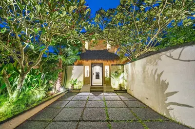 an entrance to a home with trees and a walkway at Tropical 3BR Villa Private Pool in Jimbaran in Jimbaran