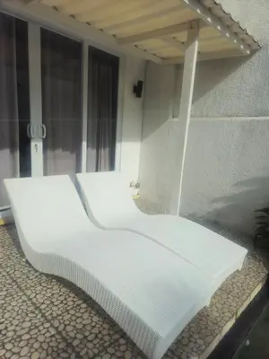 a white bench sitting on the side of a building at Seminyak Luxe Villa Near Beach, Breakfast Concierge in Seminyak