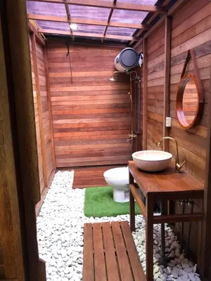 a bathroom with a toilet and a sink at Cozy Lagoon Bungalows & Pool in Nusa Dua