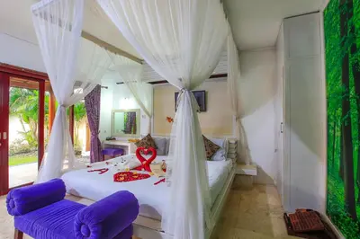 a bedroom with a bed with a ribbon on it at 1 Bed Room Villa in Kuta Central in Kuta