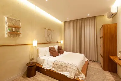 a bedroom with a bed in a room at Casa Amani 3BR Terracotta Seminyak in Kerobokan