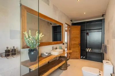 a bathroom with a sink and a toilet at Konoha Villa Umalas in Mantaak