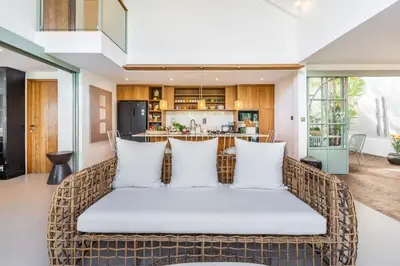 an open living room with a couch with pillows at luxury villa in seminyak in Seminyak
