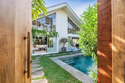 an exterior view of a house with a swimming pool at luxury villa in seminyak in Seminyak