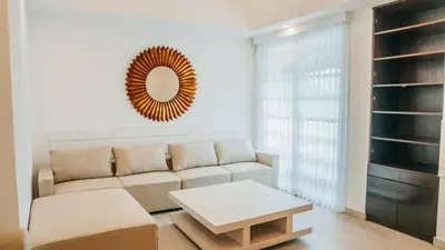 a living room with a couch and a table at Apartment Nata Umalas in Seminyak