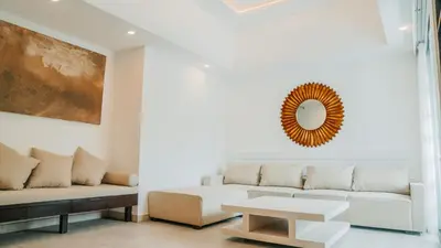 a living room with a couch and a table at Apartment Nata Umalas in Seminyak