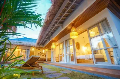 a house with a porch with a bed and a chair at NEW 3BR Fleur De Vie Tranquility Villa in Seminyak in Seminyak