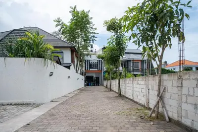 a brick road in front of houses at Tuluscoliving Villa Kuta 4, 2 Bedroom & 2 Bathroom in Ngurah Rai International Airport