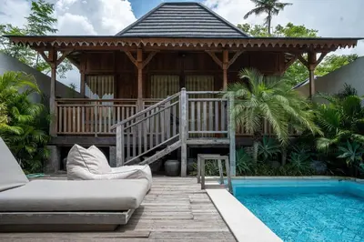 a house with a gazebo and a swimming pool at Tuluscoliving Villa Kuta 4, 2 Bedroom & 2 Bathroom in Ngurah Rai International Airport