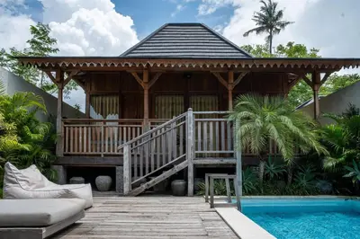 a gazebo with a deck next to a pool at Tuluscoliving Villa Kuta 4, 2 Bedroom & 2 Bathroom in Ngurah Rai International Airport