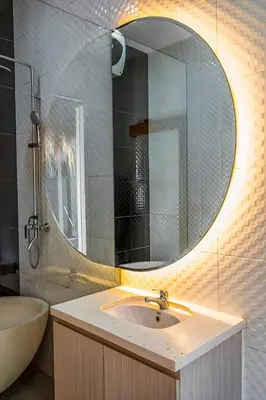 a bathroom with a sink and a mirror at Modern 2BR Villa in Seminyak Center - Private Pool in Seminyak