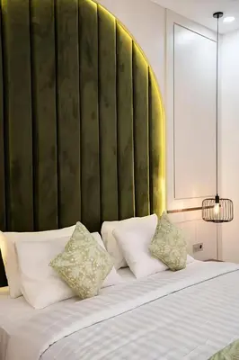 a bedroom with a large bed with white pillows at Modern 2BR Villa in Seminyak Center - Private Pool in Seminyak
