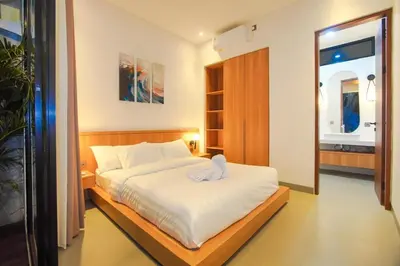 a bedroom with a bed with a towel on it at Rama Villa Umalas in Kerobokan