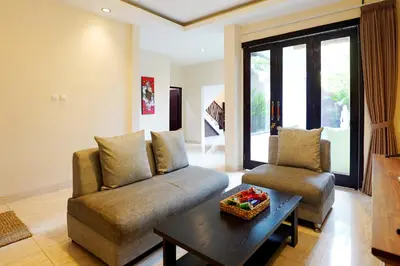 a living room with a couch and a table at 3 Bedrooms Villa with Pool WEST SANUR - Casa Del Lago in Sanur