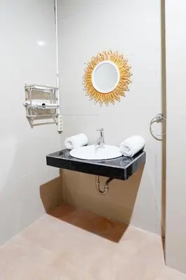a bathroom with a sink and a mirror at 3 Bedrooms Villa with Pool WEST SANUR - Casa Del Lago in Sanur