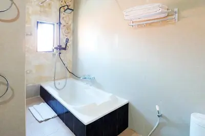 a bathroom with a sink and a bath tub at 3 Bedrooms Villa with Pool WEST SANUR - Casa Del Lago in Sanur