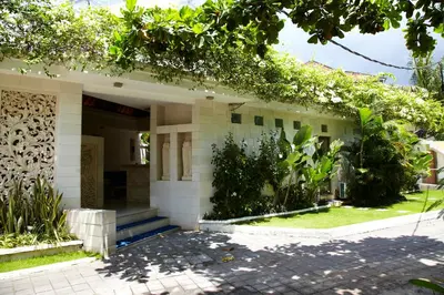 a building with plants on the side of it at M-Apartment in Badung