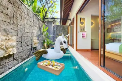 a swimming pool with a toy duck in a house at Edna Royal 1 BR Private Pool Villa With Jacuzzi in Legian