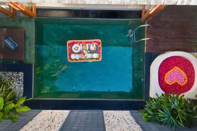 a aquarium in the front of a house at Bahira Lovely 1 BR Grand Pool Villa With Bathtub in Legian
