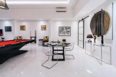 a living room with a pool table and a billiards at Modern 2BR Pool Villa in Umalas with Billiard & Long Pool in Canggu