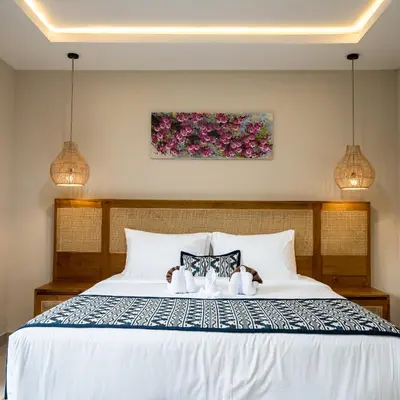 a bedroom with a bed with two teddy bears on it at Villa Inges 1 Seminyak in Seminyak