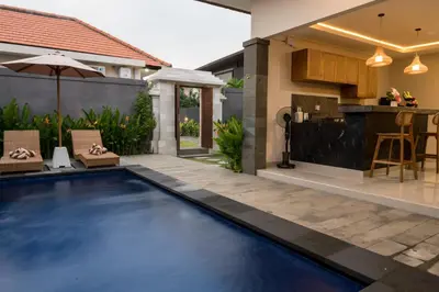 a swimming pool in the backyard of a house at Villa Inges 1 Seminyak in Seminyak