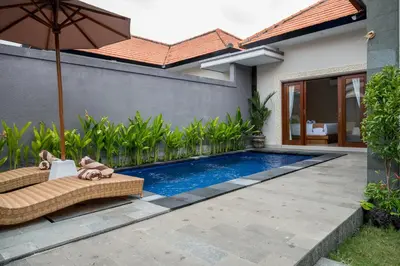 a swimming pool in the backyard of a house at Villa Inges 2 Seminyak in Seminyak