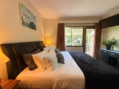 a bedroom with a large bed with white sheets and pillows at Apartment at Jayakarta Residence 6214 in Seminyak