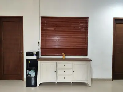 a kitchen with a sink and a window next to a refrigerator at Royal villa nusa dua quiet 2BR with public pool in Nusa Dua