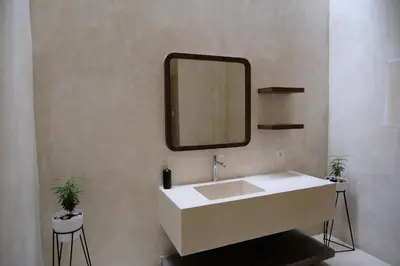 a bathroom with a sink and a mirror on the wall at Avaya Boutique Hostel by Ayodya Beach Inn in Legian