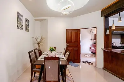 a dining room with a table and chairs at Private 5BR Jimbaran House with Pool, up to 12 Pax in Jimbaran