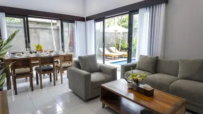 a living room with a couch and a table at 3BR Private Pool Villa in Central Seminyak - Walk to Cafés & Shops in Seminyak