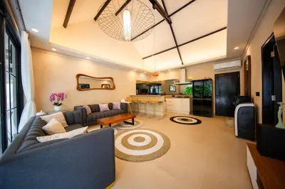 a living room with a couch and a table at Amazing Private Pool Villa 2BR in Seminyak Bali in Kerobokan