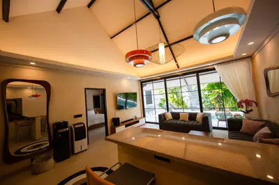a living room with a couch and a table at Amazing Private Pool Villa 2BR in Seminyak Bali in Kerobokan
