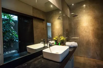 a bathroom with a sink and a mirror at Seminyak Villa in Seminyak