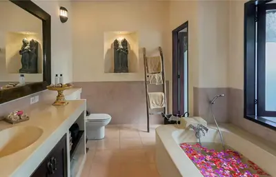 a bathroom with a tub and a toilet and a sink at Luxury 6-bedroom Villa in Seminyak in Seminyak