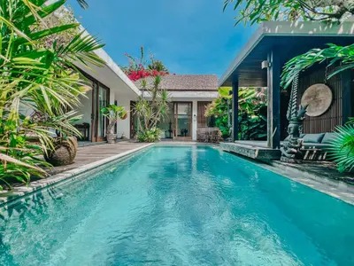 a swimming pool in the backyard of a villa at Umalas cozy 3 Bedrooms private pool villa in Kerobokan