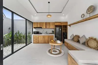 a living room with a couch and a table at Nara V3 2BR Escape in the Heart of Seminyak in Seminyak