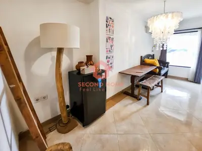 a living room with a table and a lamp at Strategic 2BR Seminyak House UP2 6 Person in Seminyak