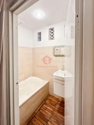 a bathroom with a bath tub and a sink at Strategic 2BR Seminyak House UP2 6 Person in Seminyak