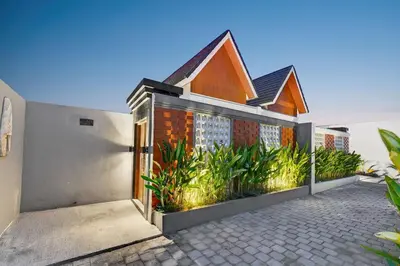 a brick house with plants in front of it at Nara V11 2BR Escape in the Heart of Seminyak in Seminyak