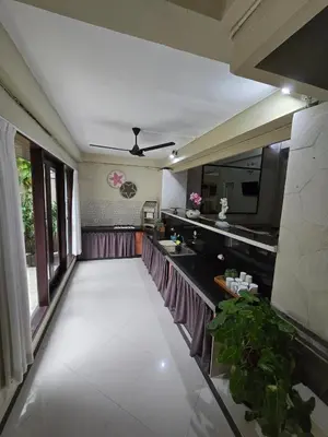 a kitchen with a large white floor and a ceiling at Happy's house Bali in Kerobokan