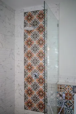 a bathroom with a shower with a tile wall at Tropical 3BR Oasis w Private Pool Villa Nau Mai in Seminyak